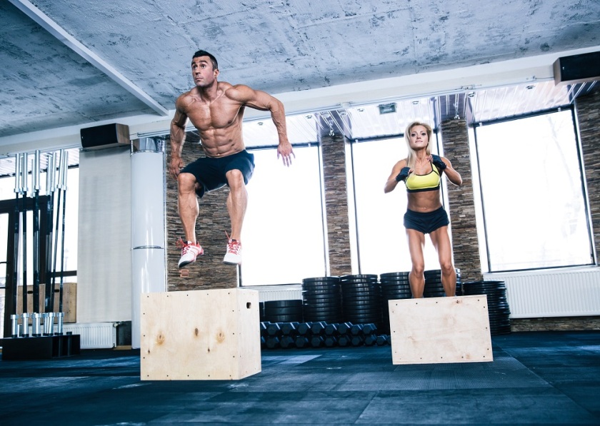man and woman doing box jumps, a type of plyometric exercise