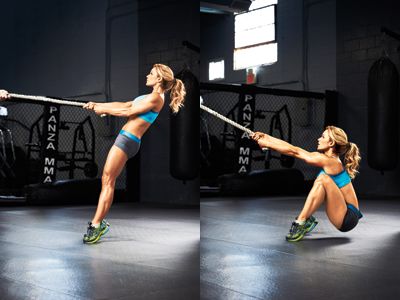 Female doing rope squats with the TRX Cables